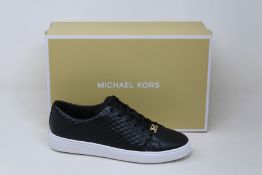 A pair of as new Michael Kors Keaton lace up sneakers (US 6M).