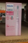 A boxed as new Philips Sonicare 3100 electric toothbrush (Pink).