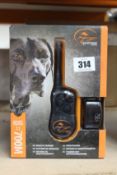 A boxed as new SportDOG SportTrainer 700M remote trainer.