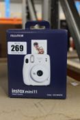 A FUJIFILM Instax mini11 Instant Camera.