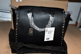 An as new Nova Harley Luxury Nevada leather changing bag.