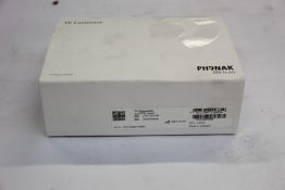 A boxed as new Phonak TV Connector (REF: 076-3002-06).