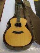 A Taylor Academy 12e Grand Concert Electro Acoustic Guitar with Gig Bag.