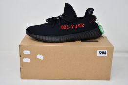 A pair of as new Adidas Yeezy Boost 350 V2 with authentication tag (UK 12).