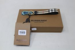 An as new Burberry leather trim vintage check charm (RRP $260).