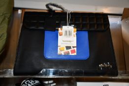 An as new Nova Harley Luxury Athens leather changing bag.