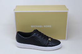 A pair of as new Michael Kors Keaton lace up sneakers (US 8M).