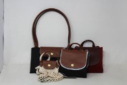 Four assorted as new Longchamps bags.