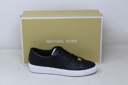 A pair of as new Michael Kors Keaton lace up sneakers (US 7.5M).
