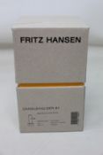 Four boxed as new Fritz Hansen solid brass candle holders (H 10.5cm).