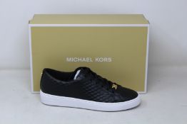 A pair of as new Michael Kors Keaton lace up sneakers (US 6M).