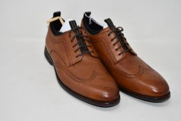A pair of as new Cole Haan shoes in brown (US 10M - No box).