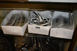 Three boxes of unbranded sunglasses.