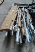 A quantity of various weight bars and related items.