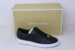 A pair of as new Michael Kors Keaton lace up sneakers (US 8M).