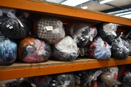 Ten bags of pre-owned clothing and related items.