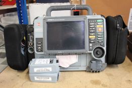 A pre-owned Lifepak 15 Monitor/Defibrillator with wires, accessories and two Li-ion rechargeable