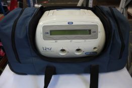 A pre-owned Hill-Rom the vest 105 airway clearance system with carry bag and accessories.