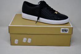 A pair of as new Michael Kors Keaton lace up sneakers (US 9M).