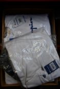Twenty items of assorted as new Champion clothing and accessories.