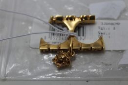 An as new Versace two-finger ring (No box).