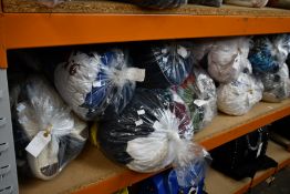 Eleven bags of pre-owned clothing and related items.