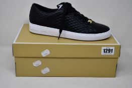 A pair of as new Michael Kors Keaton lace up sneakers (US 8.5M).