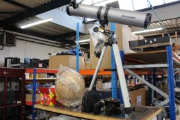 A pre-owned Zenit-e camera, an antique style world globe on wooden stand, Celestron Powerseeker
