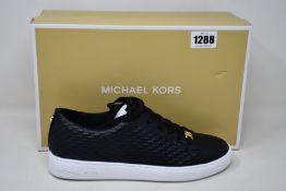 A pair of as new Michael Kors Keaton lace up sneakers (US 8.5M).