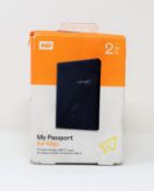 A boxed as new WD 2TB My Passport for Mac Portable Hard Drive (Box sealed, damage to box).