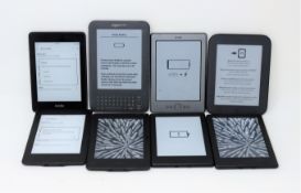 Seven pre-owned Amazon Kindle E-Readers: 1 x Paperwhite 10th Gen, 2 x Paperwhite 7th Gen (one with d