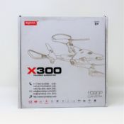 A boxed as new Syma X300 Folding Quadcopter Drone (Damaged box).