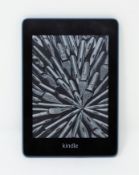 A pre-owned Amazon Kindle 10th Gen in Teal.