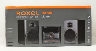 A boxed as new Roxel RCD-250BT Micro Hi-Fi CD/DVD Player in Black (Box sealed).
