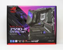 A boxed as new ASUS ROG Strix Z590-E Gaming WiFi ATX Motherboard (P/N: 90MB1640-M0EAY0) (Box opened)
