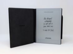 A pre-owned reMarkable 2 Paper Tablet with a Marker Plus Stylus and Book Folio in Grey Fabric.
