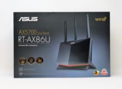A boxed as new ASUS RT-AX86U 5700 Dual Band + WiFi 6 Gaming Router.