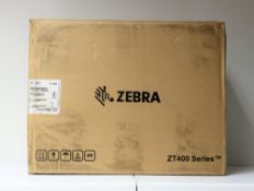 A boxed as new Zebra ZT41142-T0E0000Z Mid-Range Industrial Label Printer (Box opened, some damage to