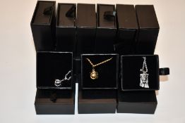 Fifteen items of assorted Haraves jewellery to include 5x silver and 5x gold Globes and 5x Jesus.
