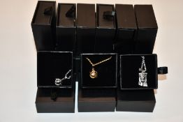 Fifteen items of assorted Haraves jewellery to include 5x silver and 5x gold Globes and 5x Jesus.