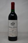 A bottle of 1989 Chateau Montrose Saint-Estephe J L Charmolüe (Over 18s only).