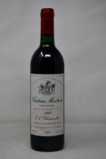 A bottle of 1989 Chateau Montrose Saint-Estephe J L Charmolüe (Over 18s only).
