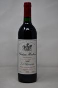 A bottle of 1989 Chateau Montrose Saint-Estephe J L Charmolüe (Over 18s only).