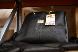 An as new Nova Harley Luxury Melbourne leather changing bag.