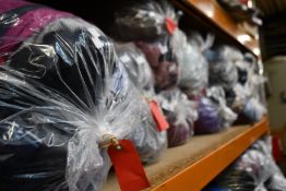 Ten bags of pre-owned clothing and related items.