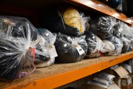 Ten bags of pre-owned clothing and related items.