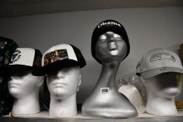 Three as new baseball caps; Supreme Lady Pink, Triumph Taylor Bone and New Era NFL and a Supreme