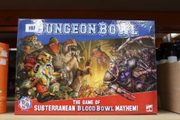 A boxed as new Warhammer Dungeon Bowl game (No outer cellophane seal but as new and complete).
