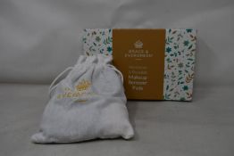 Forty boxed Grace and Evergreen washable and reusable makeup remover pads.