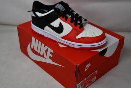 Two pairs of youths as new Nike Dunk Low (UK 4.5).